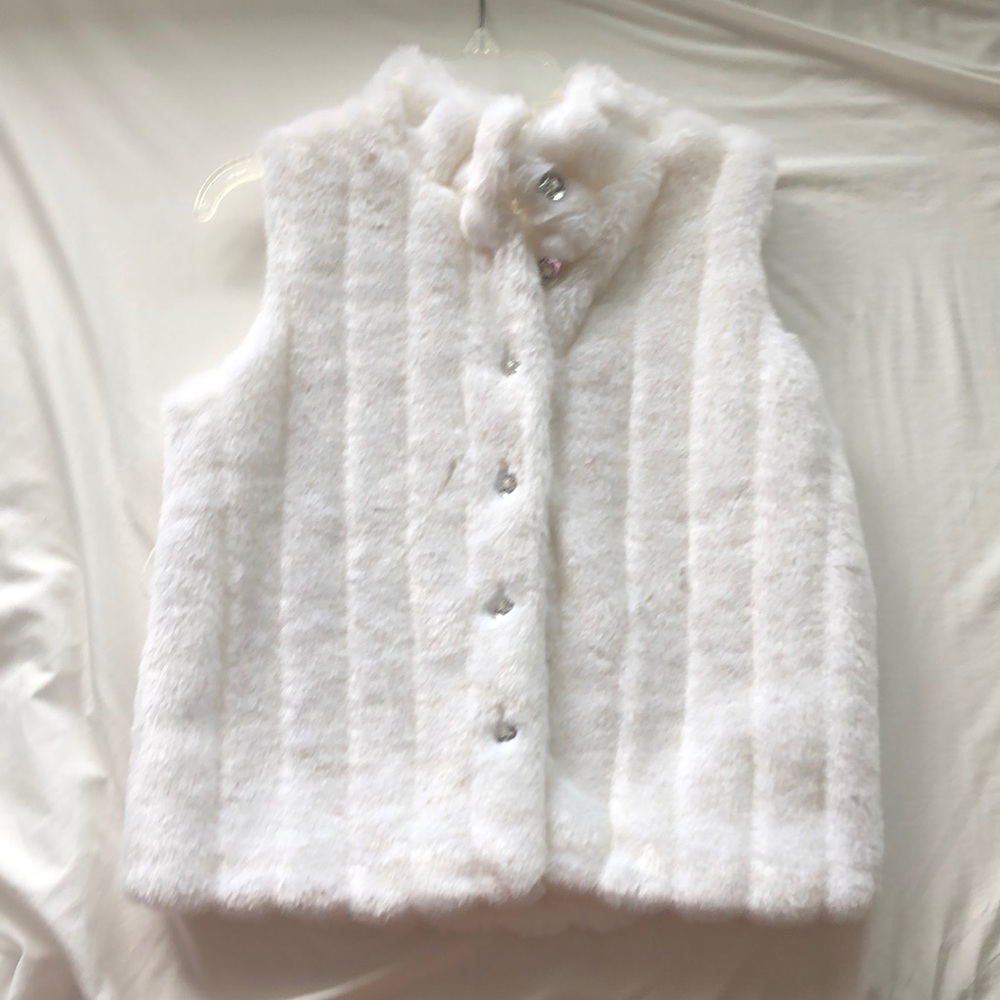 White fur vest